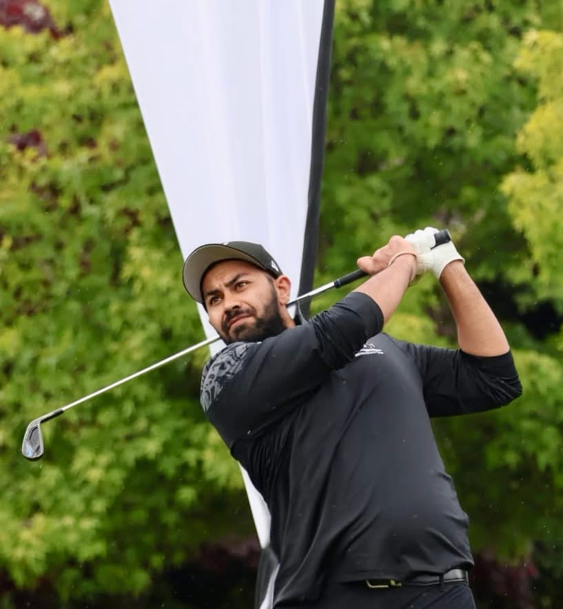 Tarun Chadha watching his shot flight down the fairway