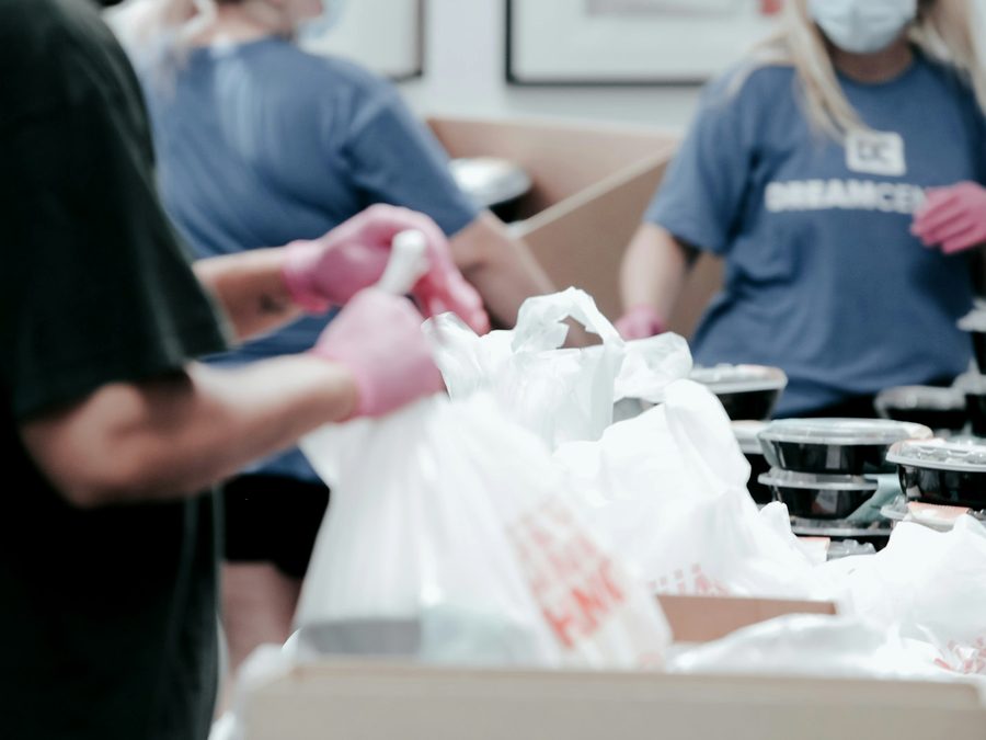 Volunteers packing food bags at a community food drive